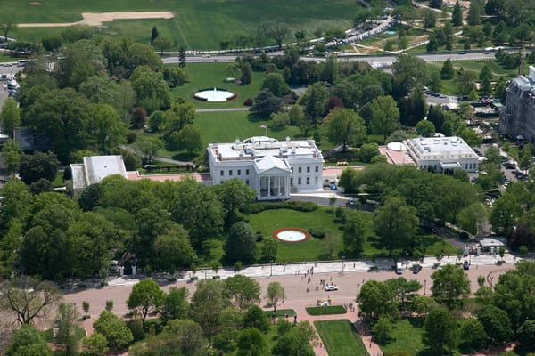 Aerial view of White House, Executive Residence, North Portico, East Wing, West Wing and Oval Office at southeast corner.